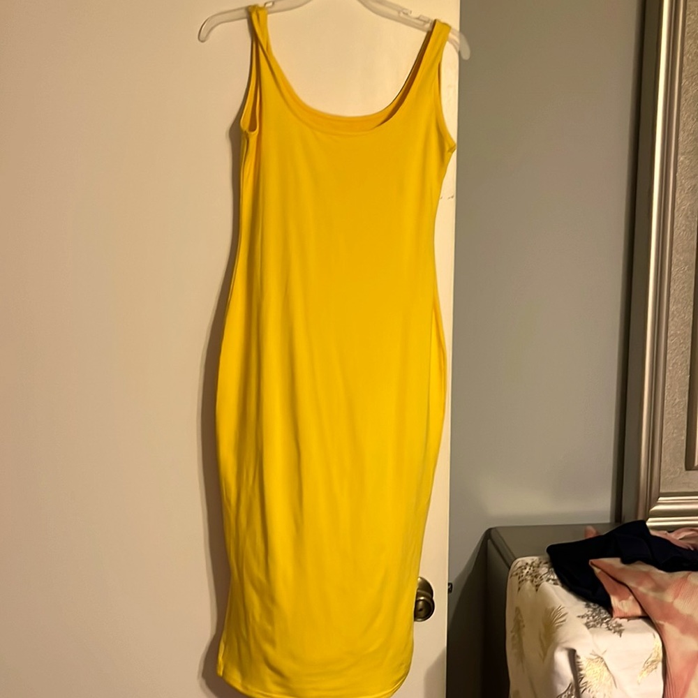 Bright yellow bodycon dress.
